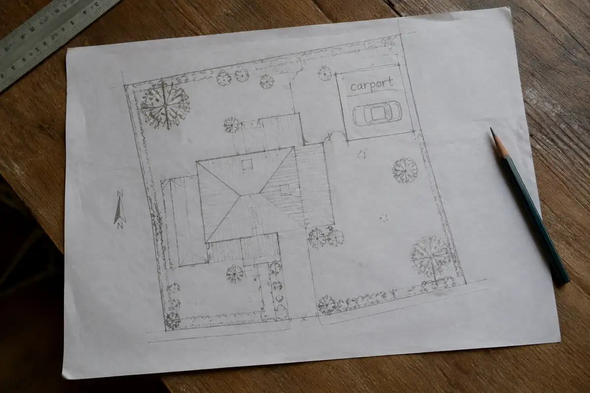 Plan de terrain vu de dessus avec un rectangle de carport tracé